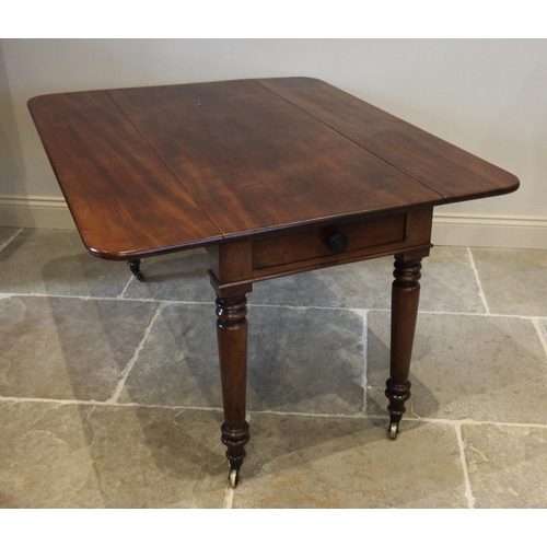 753 - A mid 19th century Pembroke table, the rectangular drop leaf top with rounded corners, above a singl... 