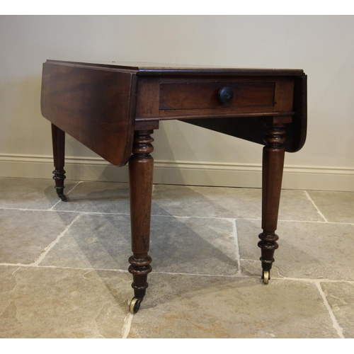 753 - A mid 19th century Pembroke table, the rectangular drop leaf top with rounded corners, above a singl... 