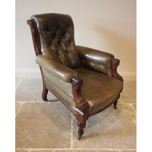 754 - A late Victorian green leather and walnut drawing room chair, the button back over padded arms exten... 