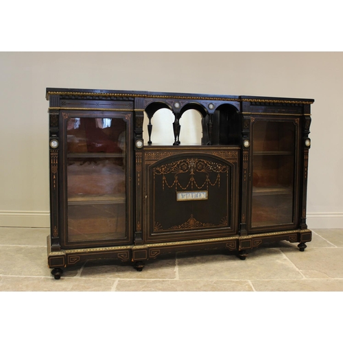 755 - A late Victorian ebonised Aesthetic movement inverted breakfront credenza, having a central arcaded ... 