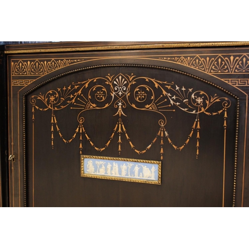 755 - A late Victorian ebonised Aesthetic movement inverted breakfront credenza, having a central arcaded ... 