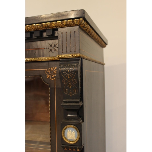 755 - A late Victorian ebonised Aesthetic movement inverted breakfront credenza, having a central arcaded ... 