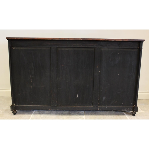 755 - A late Victorian ebonised Aesthetic movement inverted breakfront credenza, having a central arcaded ... 