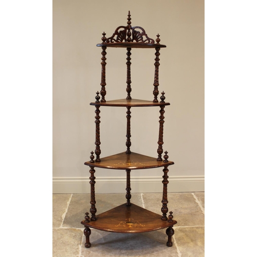 757 - A Victorian walnut freestanding corner what-not, with a fret work gallery over four graduated tiers,... 