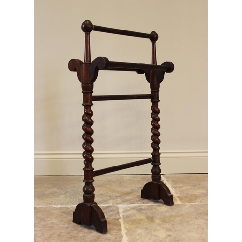 759 - A Victorian mahogany towel rail, of cottage proportions, the barley twist uprights extending to down... 