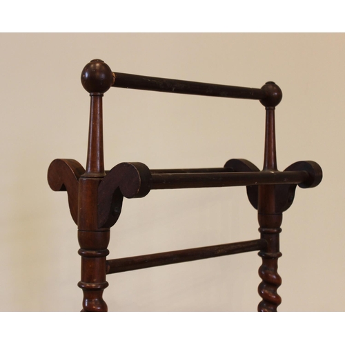 759 - A Victorian mahogany towel rail, of cottage proportions, the barley twist uprights extending to down... 