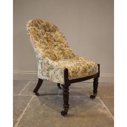 762 - A Victorian button back nursing chair, in floral fabric, raised upon ring turned walnut front legs, ... 