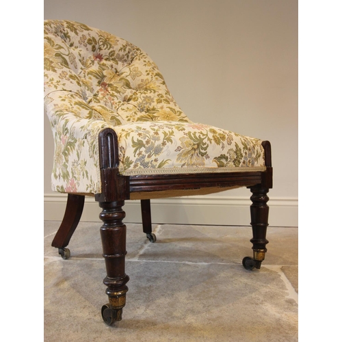 762 - A Victorian button back nursing chair, in floral fabric, raised upon ring turned walnut front legs, ... 