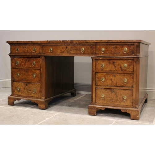 768 - A 19th century figured walnut faux partners desk, the rectangular top with an inset green skiver wri... 