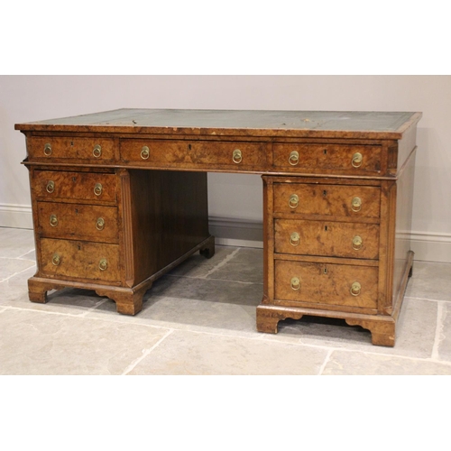 768 - A 19th century figured walnut faux partners desk, the rectangular top with an inset green skiver wri... 