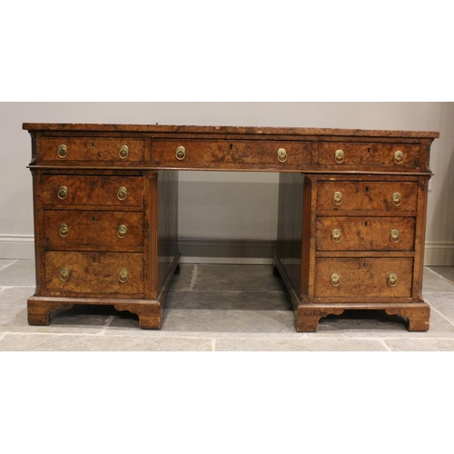 768 - A 19th century figured walnut faux partners desk, the rectangular top with an inset green skiver wri... 