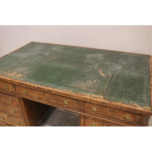 768 - A 19th century figured walnut faux partners desk, the rectangular top with an inset green skiver wri... 