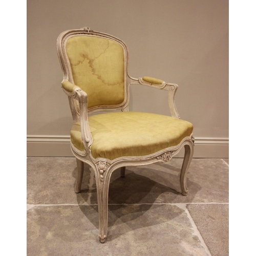 769 - A Louis XVI style French fauteuil, early 20th century, the padded back rest above a serpentine seat,... 