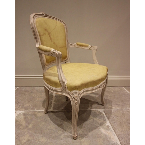 769 - A Louis XVI style French fauteuil, early 20th century, the padded back rest above a serpentine seat,... 