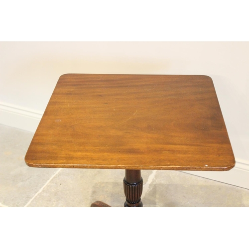 770 - An early 19th century mahogany tripod table, the square top with rounded corners upon a tapering col... 