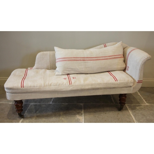 772 - A late Victorian chaise longue, later re-covered, the shaped back enclosing a loose seat cushion, ra... 