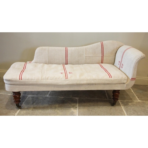 772 - A late Victorian chaise longue, later re-covered, the shaped back enclosing a loose seat cushion, ra... 