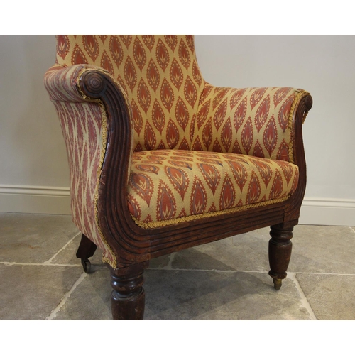 782 - A William IV mahogany and upholstered Empire style library chair, the padded arms above a reeded apr... 