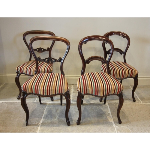 785 - A pair of Victorian rosewood compressed balloon back dining chairs, each with an open work interlace... 