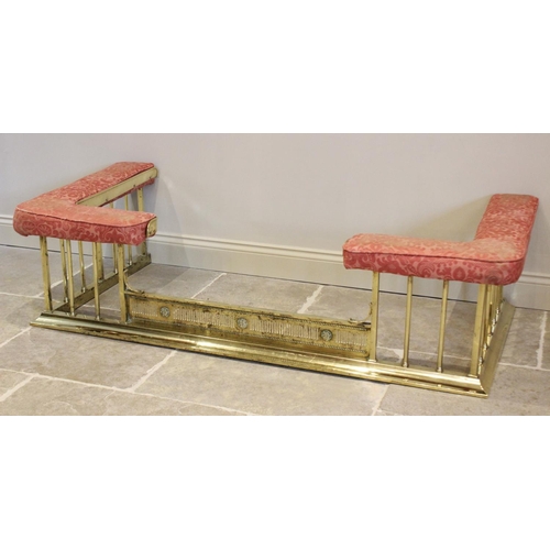 795 - An early 20th century brass and upholstered club fender, of typical angular form, the upholstered se... 