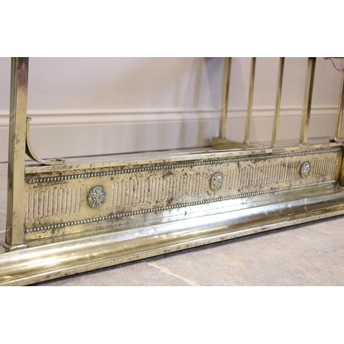 795 - An early 20th century brass and upholstered club fender, of typical angular form, the upholstered se... 