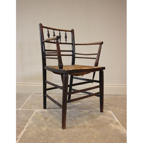 798 - William Morris, an Arts & Crafts Sussex type chair, the gentle concave back rail with four ring turn... 