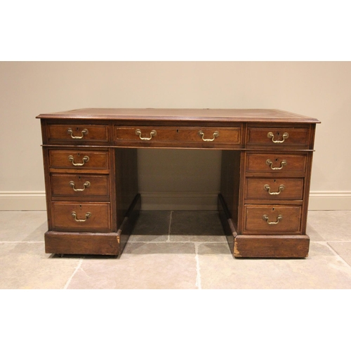 799 - An early 20th century walnut pedestal desk, the leather inset rectangular top with three drawers upo... 