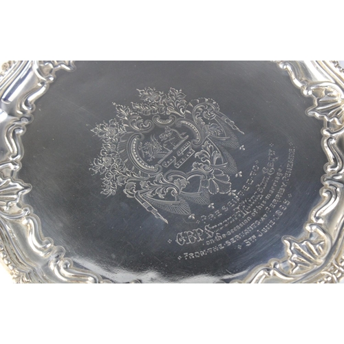 8 - A Victorian silver salver by Martin, Hall & Co, London 1890, of circular from with beaded and emboss... 