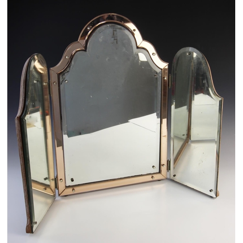 801 - An Art Deco triptych mirror, the central bevelled plate with shaped top enclosed by a pink bevelled ... 