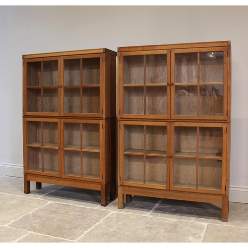 803 - A pair of early/mid 20th century oak glazed bookcases, each with a pair of four panel glazed doors, ... 