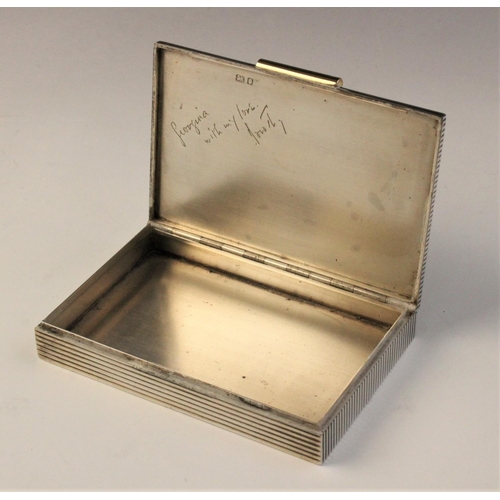 81 - An Art Deco silver cigarette box by Cartier, London 1937, of rectangular form with reeded decoration... 