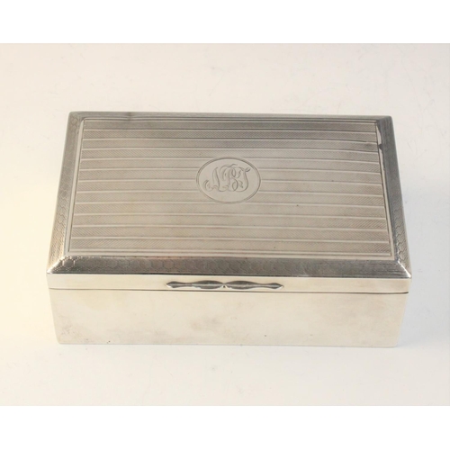 82 - A George V silver mounted cigarette box by Henry Matthews, Birmingham 1922, of rectangular form with... 