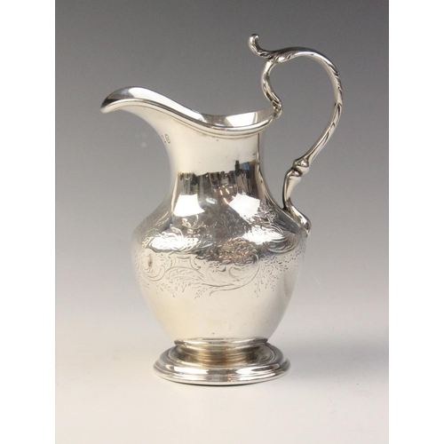 87 - A Scottish Victorian silver jug, possibly by James McKay, Edinburgh 1860, of baluster form on steppe... 