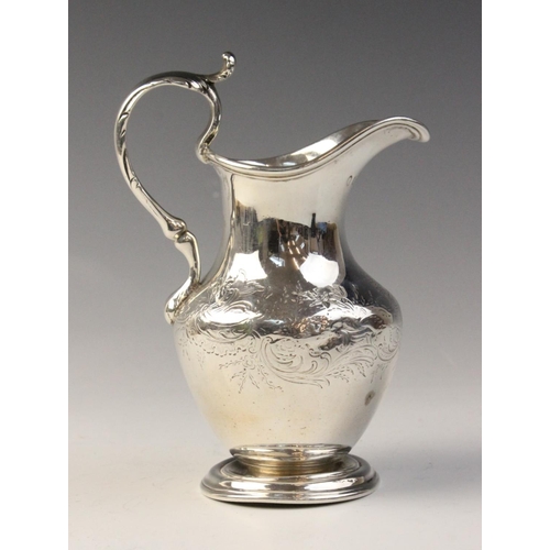 87 - A Scottish Victorian silver jug, possibly by James McKay, Edinburgh 1860, of baluster form on steppe... 