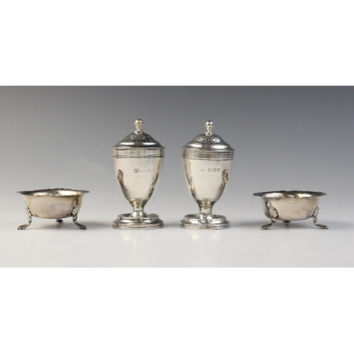 88 - A pair of George V silver pepperettes by S Blanckensee & Son Ltd, Birmingham 1914, each of urn form ... 