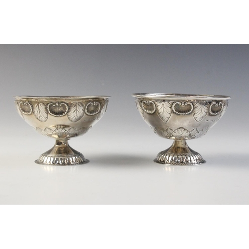 89 - A matched pair of Victorian silver bon-bon dishes, one marked for London 1857, the other for 1870 (m... 