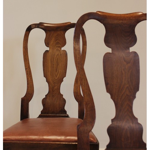 678 - A pair of George I walnut side chairs, each with a vase shaped splat over a drop in upholstered seat... 