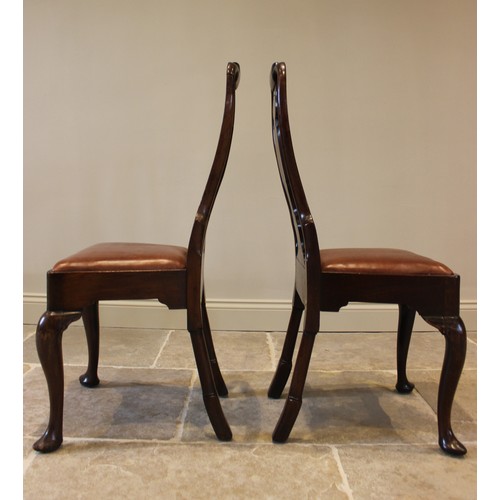 678 - A pair of George I walnut side chairs, each with a vase shaped splat over a drop in upholstered seat... 