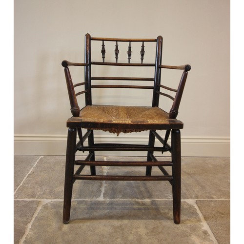 798 - William Morris, an Arts & Crafts Sussex type chair, the gentle concave back rail with four ring turn... 