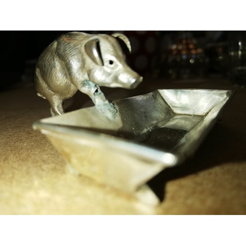 125 - A novelty silver open salt, Chester circa 1900, realistically modelled as a pig and trough, the trou... 