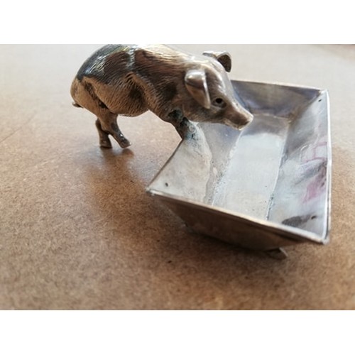 125 - A novelty silver open salt, Chester circa 1900, realistically modelled as a pig and trough, the trou... 