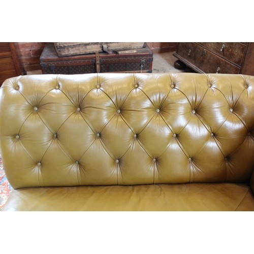 790 - A Victorian olive green leather Chesterfield corner settee, of 'L' shape, the shaped back rest uniti... 