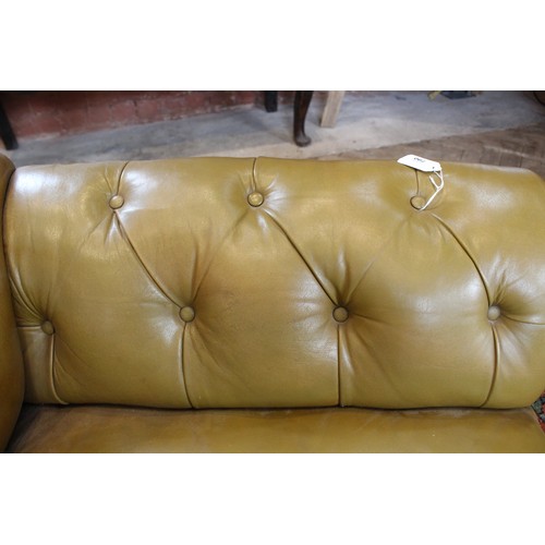 790 - A Victorian olive green leather Chesterfield corner settee, of 'L' shape, the shaped back rest uniti... 