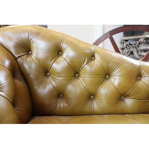 790 - A Victorian olive green leather Chesterfield corner settee, of 'L' shape, the shaped back rest uniti... 