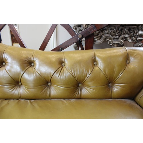 790 - A Victorian olive green leather Chesterfield corner settee, of 'L' shape, the shaped back rest uniti... 