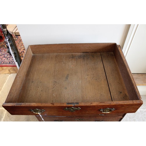 775 - A 19th century oak bachelor’s chest, the rectangular thumb moulded top above four graduated long dra... 