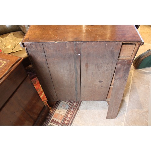 775 - A 19th century oak bachelor’s chest, the rectangular thumb moulded top above four graduated long dra... 