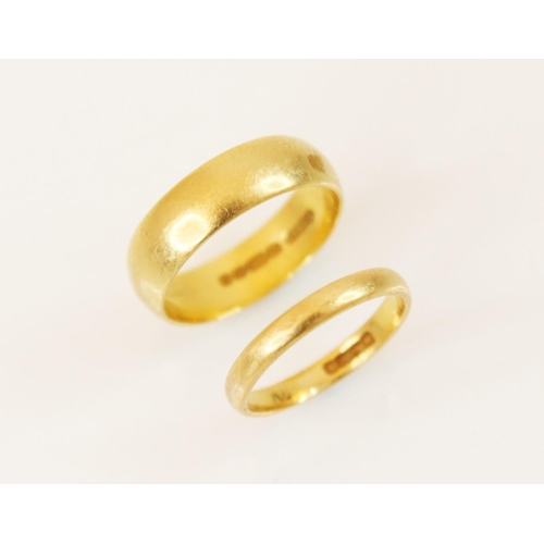 102 - A 22ct gold wedding band, marks for Birmingham 1978, ring size K, together with a further example da... 