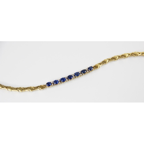 125 - A sapphire doublet and diamond set line bracelet, comprising seven oval mixed cut sapphire doublets,... 