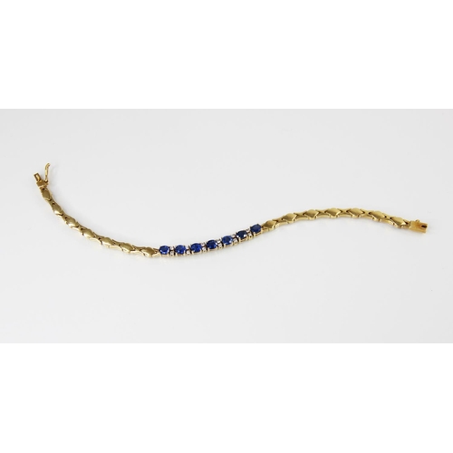 125 - A sapphire doublet and diamond set line bracelet, comprising seven oval mixed cut sapphire doublets,... 